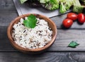 Wooden bowl with cooked white long-grain and wild rice Royalty Free Stock Photo