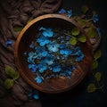 wooden bowl on a dark boho background, flowers and airy fabric, top view