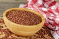 A Wooden Bowl of delicious and healthy Red Rice isolated on a wooden background Royalty Free Stock Photo