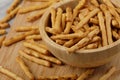 Wooden bowl of delicious mini pretzels sticks Royalty Free Stock Photo