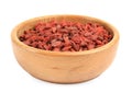 Wooden bowl with dried goji berries on white Royalty Free Stock Photo