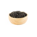 Wooden bowl of dry black beans isolated on white Royalty Free Stock Photo