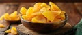 Wooden Bowl Filled With Cut Fruit