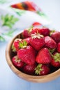 Wooden bowl filled with fresh ripe strawberries Royalty Free Stock Photo