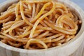 Wooden bowl filled with Spaghetti with Marinara Sauce