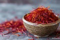 A wooden bowl filled with vibrant saffronils placed on a table, Cupful of saffron threads, rich red colour, AI Generated