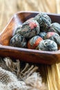 Wooden bowl with a flowering Chinese tea close up. Royalty Free Stock Photo