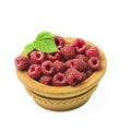 Wooden bowl full of freshly picked raspberries on white table. Royalty Free Stock Photo