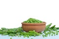 Wooden bowl full of green peas on isolated white background Royalty Free Stock Photo