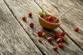 Wooden bowl full of home made strawberry marmalade