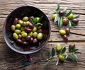 Wooden bowl full of olives.