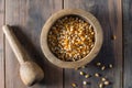 Wooden bowl full of popping corn kernals Royalty Free Stock Photo