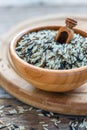 Wooden bowl full of wild and white rice. Royalty Free Stock Photo