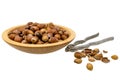 Wooden bowl with hazelnuts, nutcracker and opened nuts Royalty Free Stock Photo