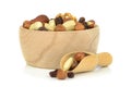 A wooden bowl of mixed fruit and nuts Royalty Free Stock Photo