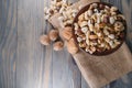 Wooden bowl with mixed nuts on rustic table top view. Healthy food and snack. Royalty Free Stock Photo