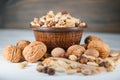 Wooden bowl with mixed nuts on rustic table top view. Healthy food and snack. Royalty Free Stock Photo