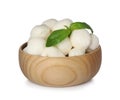 Wooden bowl with mozzarella cheese balls and basil on white background Royalty Free Stock Photo
