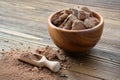 Wooden bowl of natural organic grated cocoa