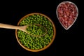 wooden bowl with peas and white bowl with iberian ham Royalty Free Stock Photo