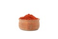 Wooden bowl with red pepper powder isolated Royalty Free Stock Photo