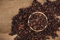 Wooden bowl with roasted coffee beans on rustic background. Royalty Free Stock Photo