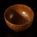 A wooden bowl for salads. Convenient bowl made of wood.