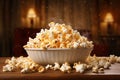 A wooden bowl of salted popcorn on a wooden table.