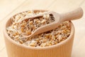 Wooden bowl and scoop filled of sprouted wheat seeds and sack of Royalty Free Stock Photo