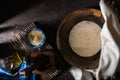 Wooden bowl of sesame seeds and olive oil Royalty Free Stock Photo