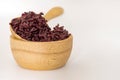 Wooden bowl and spoon with brown rice ready to eat on selective Royalty Free Stock Photo