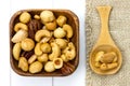 Wooden bowl and spoon filled with nuts