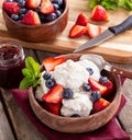 Bowl of Vanilla Ice Cream With Blueberries and Strawberries Royalty Free Stock Photo