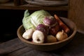 Wooden bowl with vegetables