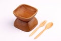 Wooden bowl with wooden fork and wooden spoon made by Teak isola Royalty Free Stock Photo
