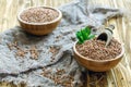 Wooden bowls with buckwheat and old sacking. Royalty Free Stock Photo