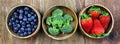 Wooden Bowls Filled With Healthy Fresh Fruit on a Rustic Wooden Background Royalty Free Stock Photo