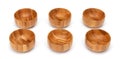 Wooden bowls isolated on white. Set of empty wood bowls round form in different angles shots in collage for your design. Royalty Free Stock Photo