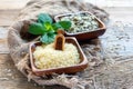 Wooden bowls with rice on the old sacking. Royalty Free Stock Photo