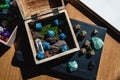 Wooden box with blue dice among role-playing game equipment Royalty Free Stock Photo