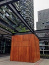 Wooden Box Cabin Between Construction and Buildings Royalty Free Stock Photo