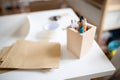 Wooden box container holder with pens on desk, natural decor concept. Royalty Free Stock Photo