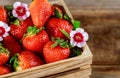 Wooden box of fresh ripe red strawberries on a farmers market Royalty Free Stock Photo