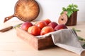 Wooden box with fresh sweet peaches on table Royalty Free Stock Photo