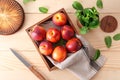 Wooden box with fresh sweet peaches on table Royalty Free Stock Photo