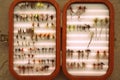 Wooden box ful of dry flies - fly fishing Royalty Free Stock Photo