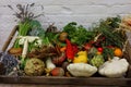 A wooden box full of mixed vegetables