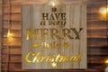 Wooden box with lights and written have a very merry little Christmas