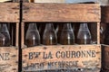 NEERIJSE, BELGIUM - SEPTEMBER 05, 2014: Wooden box with old vintage beer bottles in the brewery De Kroon in Neerijse.