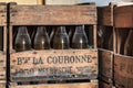 NEERIJSE, BELGIUM - SEPTEMBER 05, 2014: Wooden box with old vintage beer bottles in the brewery De Kroon in Neerijse.